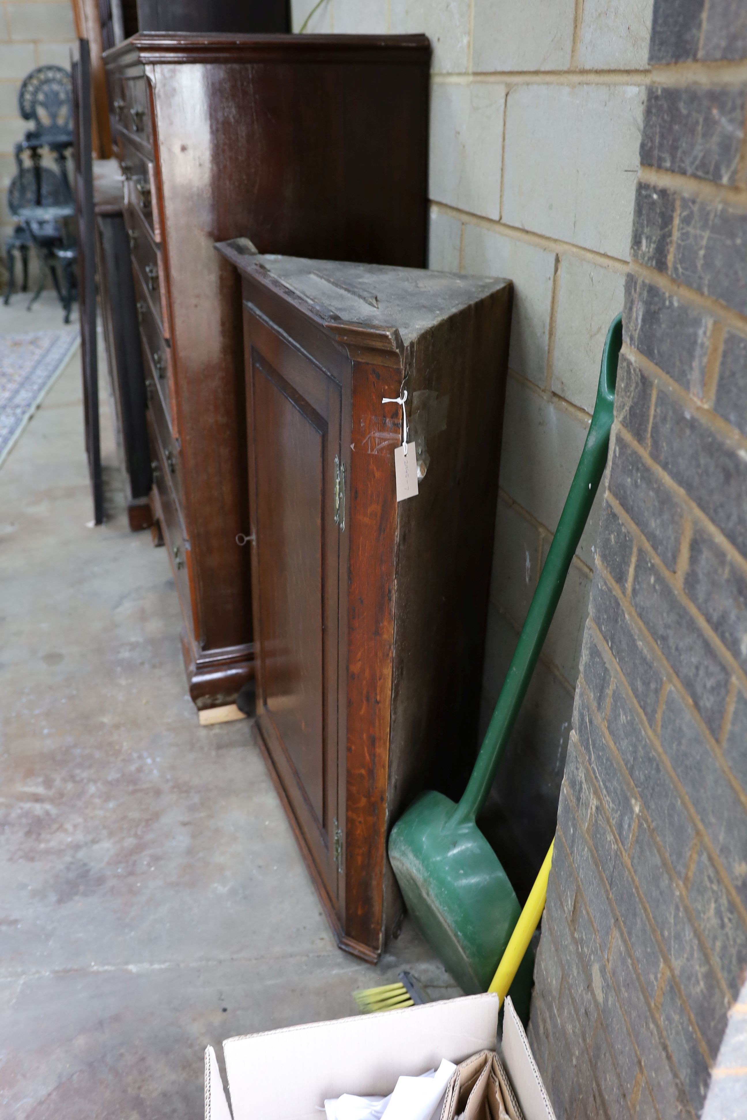 A George III oak hanging corner cabinet, width 83cm, depth 43cm, height 112cm